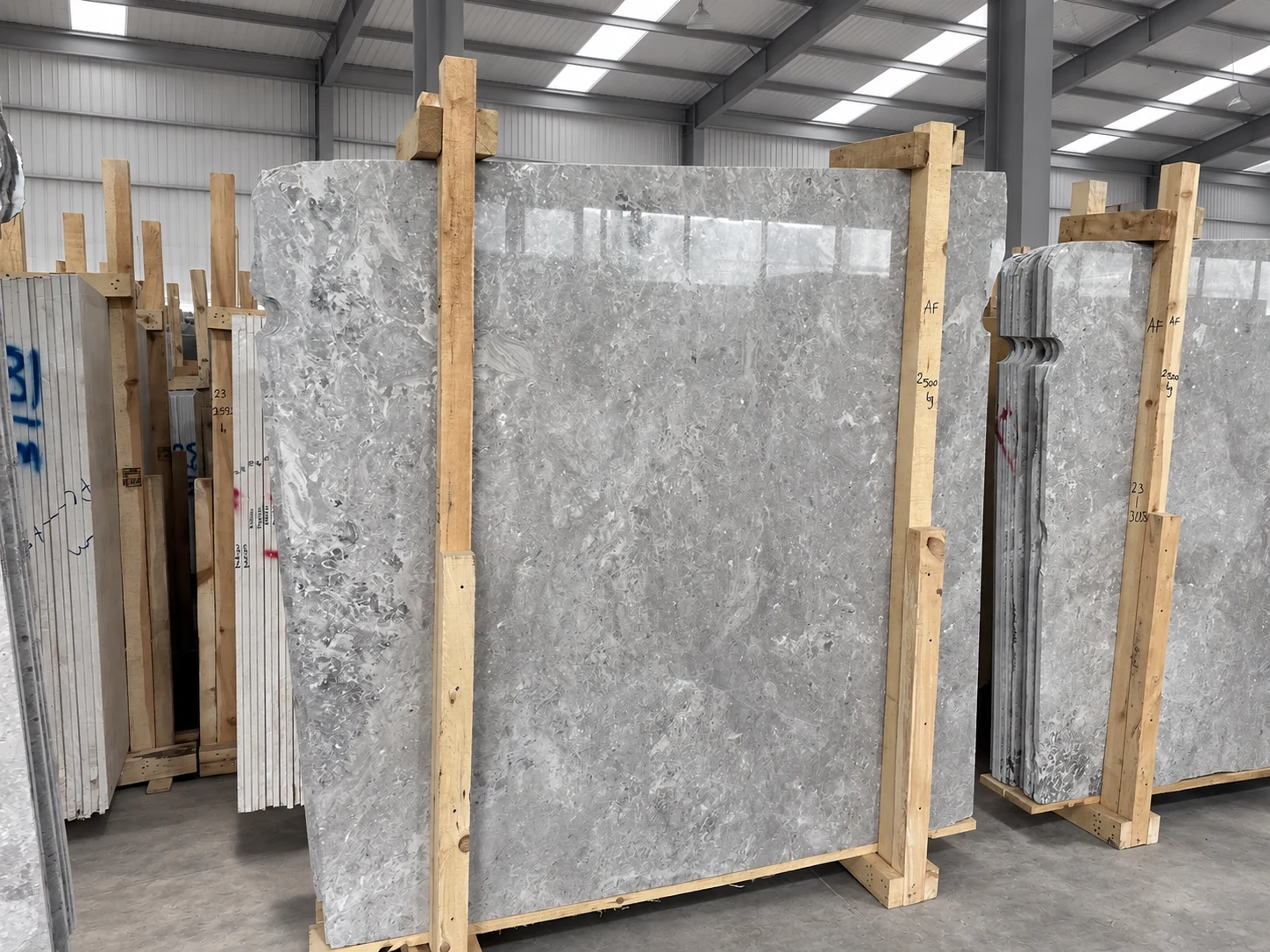 Tundra Grey marble slabs in warehouse